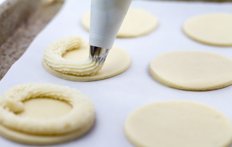 Piping Marzipan Around Shortbread Cookies